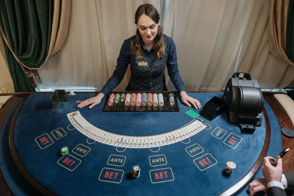 A studio table: real cards, but the payout rules do the real work.
