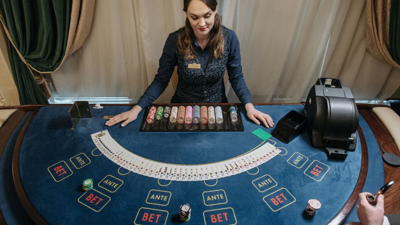 A studio table: real cards, but the payout rules do the real work.